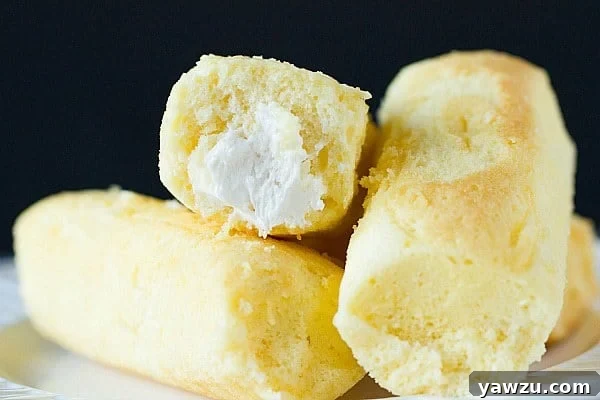 Twinkie molds made from aluminum foil next to a spice bottle