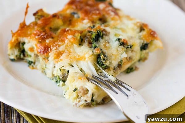 Overhead view of a Cheesy Sausage Spinach Breakfast Casserole in a baking dish