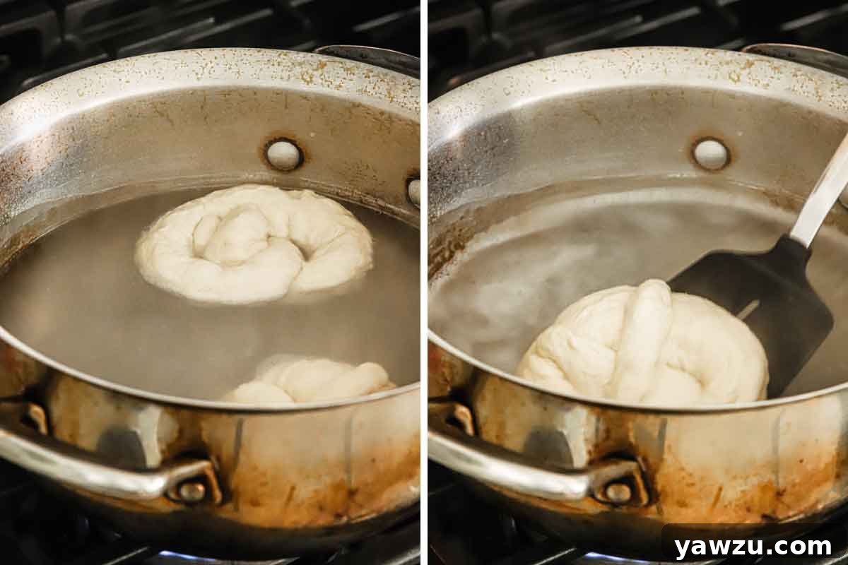 Two soft pretzels immersed in a hot baking soda bath, crucial for developing their signature chewy texture and golden crust.