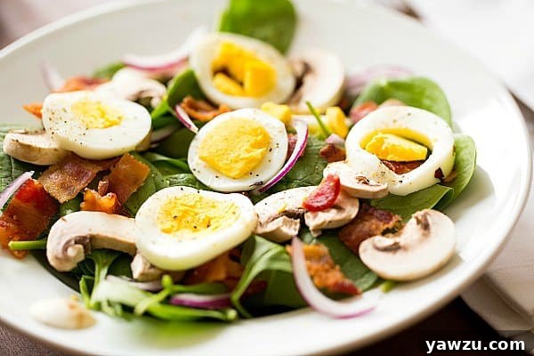 Closeup of Warm Spinach-Bacon Salad with vibrant ingredients