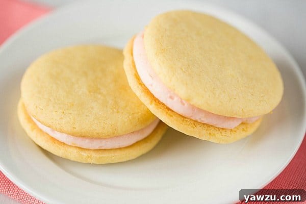 Pink Grapefruit Sandwich Cookies cooling on a rack