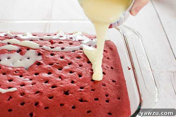 Red velvet cake is infused with sweetened condensed milk and topped with the best cream cheese frosting. A must for Valentine's Day!