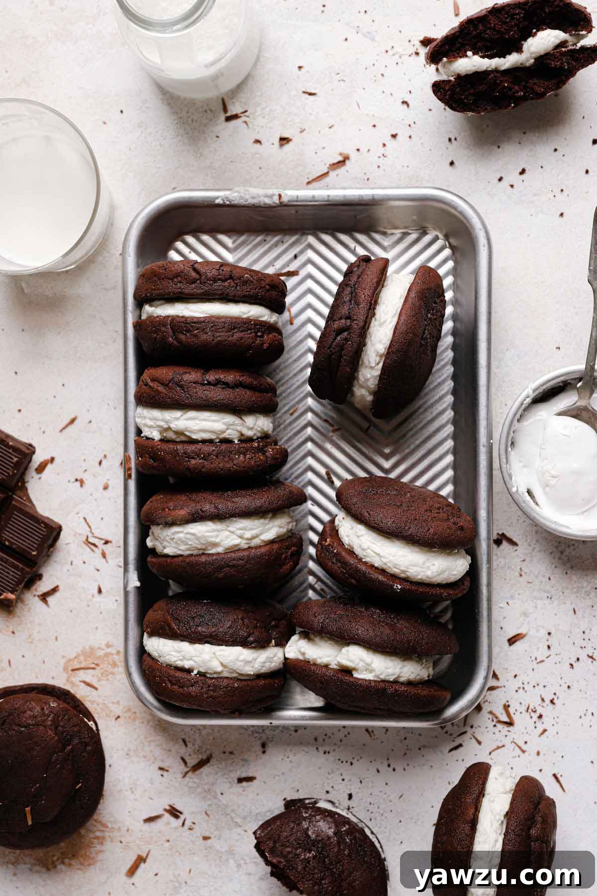 Overhead photo of assembled gobs standing on their sides in a metal baking dish, ready for serving or storage.