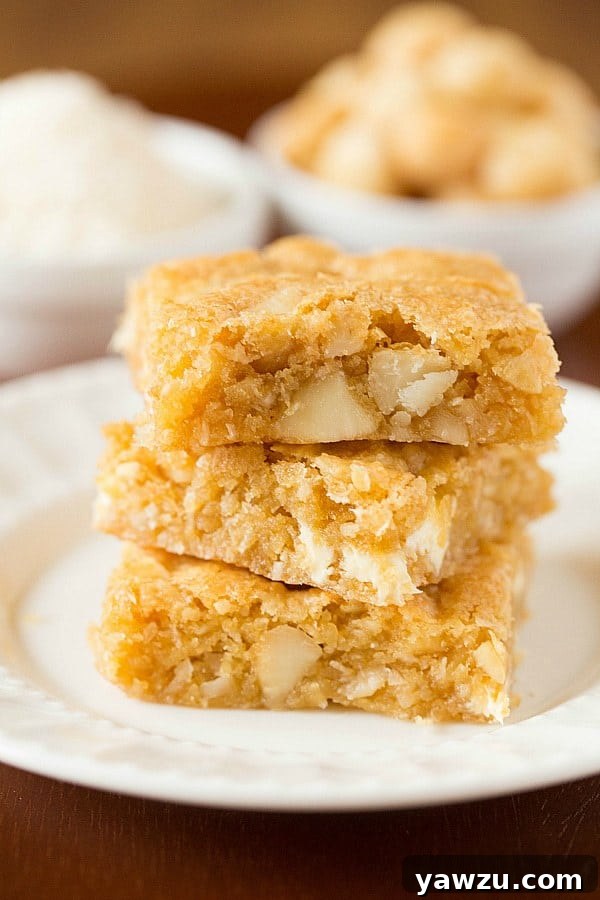 Delicious Macadamia Nut, Coconut & White Chocolate Blondies freshly baked and sliced