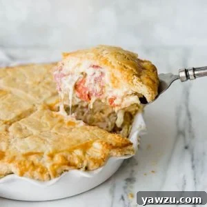 A slice of Italian Easter Pie being lifted out of the pie plate.