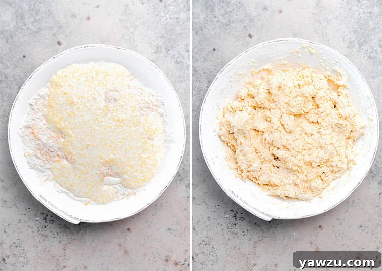 Close-up of cheddar bay biscuit dough mixed in a bowl, showing the texture before scooping.
