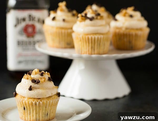 Delicious Kentucky Derby Pie Cupcakes with bourbon, walnuts, and chocolate