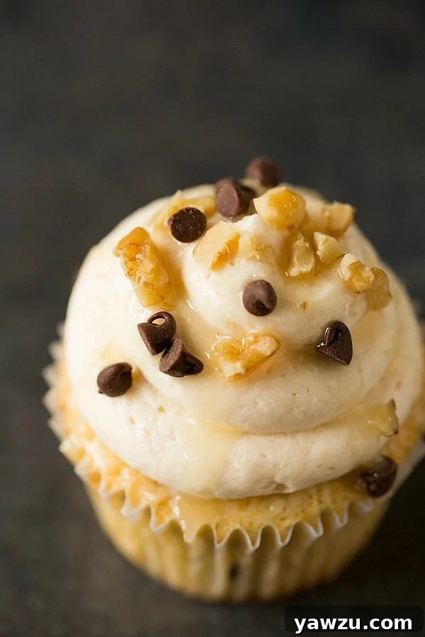 Close-up of Kentucky Derby Pie Cupcakes with bourbon glaze and toppings