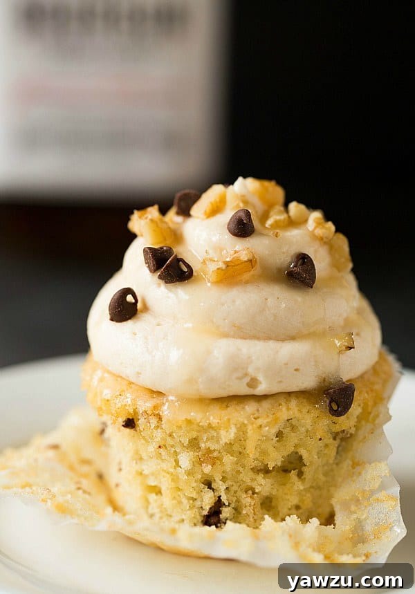 Freshly frosted Kentucky Derby Pie Cupcakes on a cooling rack