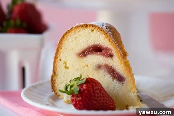 Sliced Strawberry Swirl Cream Cheese Pound Cake ready to be served