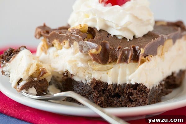 Top view close-up of a perfectly garnished Frozen Brownie Sundae with whipped cream and a cherry
