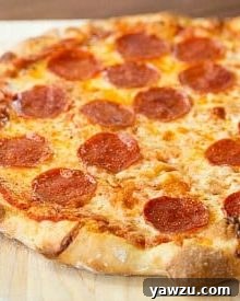Freshly baked Thin Crust Pizza with melted cheese and pepperoni