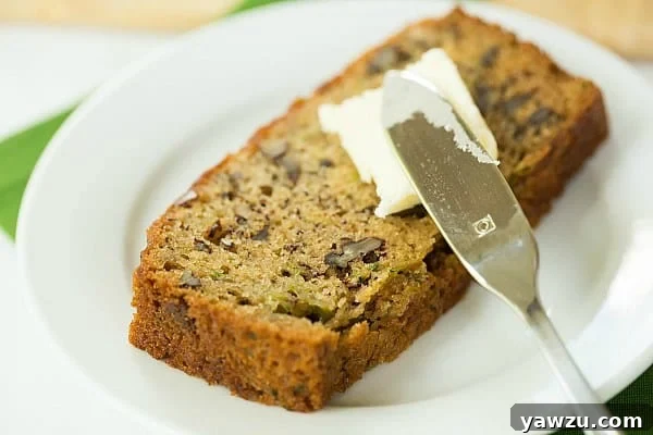 Two loaves of homemade Zucchini-Banana Bread cooling on a wire rack after baking