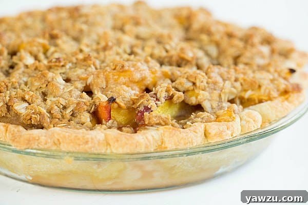 Close-up of the delicious Peach Crumble Pie cooling on a wire rack.
