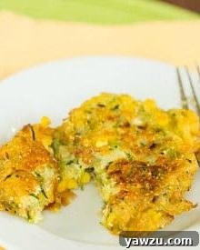 Close-up of a Zucchini-Corn Fritter, showcasing its golden-brown crust and ingredients.