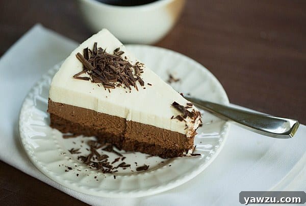 Layered Perfection: Triple Chocolate Mousse Cake by @browneyedbaker