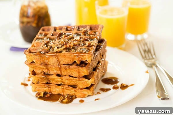 Praline Waffles drizzled with syrup and pecans