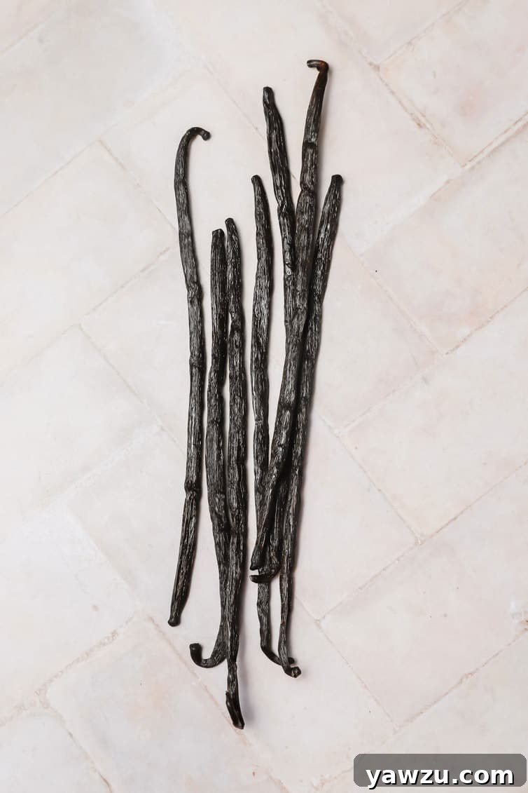 Whole vanilla beans on the counter.