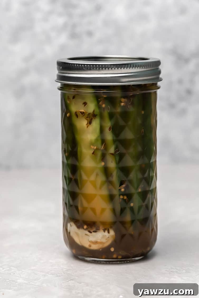 A jar of dill sandwich pickles.