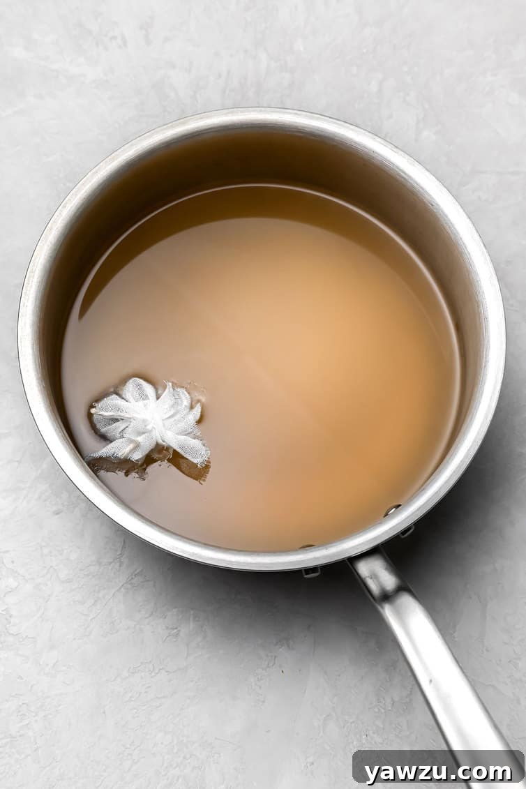 Pickling liquid with spice basket.