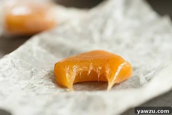 Assorted Apple Cider Caramels, wrapped individually in wax paper, ready to be shared or enjoyed.