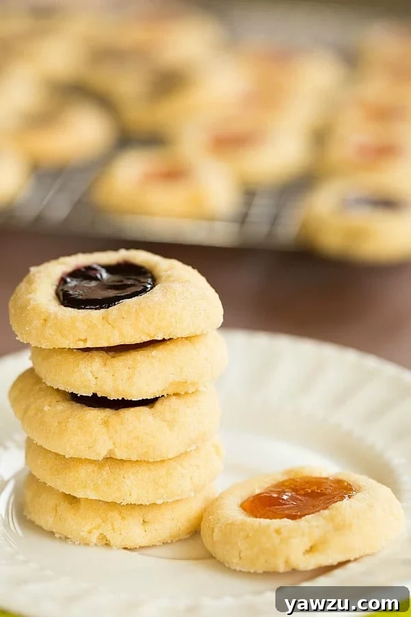 Indulge in the buttery delight of Classic Thumbprint Cookies, perfect for holiday gatherings with your favorite jam fillings. Discover the ultimate Thumbprint Cookie Recipe for a truly soft and irresistible treat.