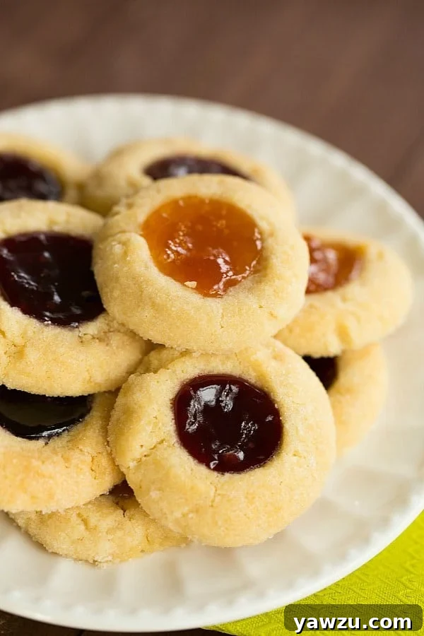 The ideal texture of Classic Thumbprint Cookies, perfectly soft and ready to hold your choice of sweet jam. A delicious and easy cookie recipe for any occasion.