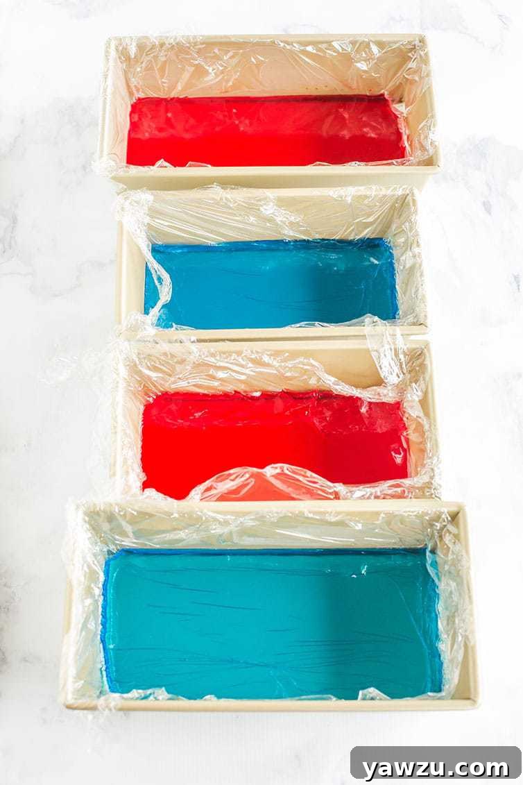 Red and blue Jello prepped in loaf pans for red, white & blue stained glass Jello stars.