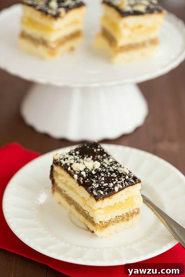 Close-up of Decker Cake layers, showcasing the sponge, walnut, pineapple, and prune butter fillings before slicing