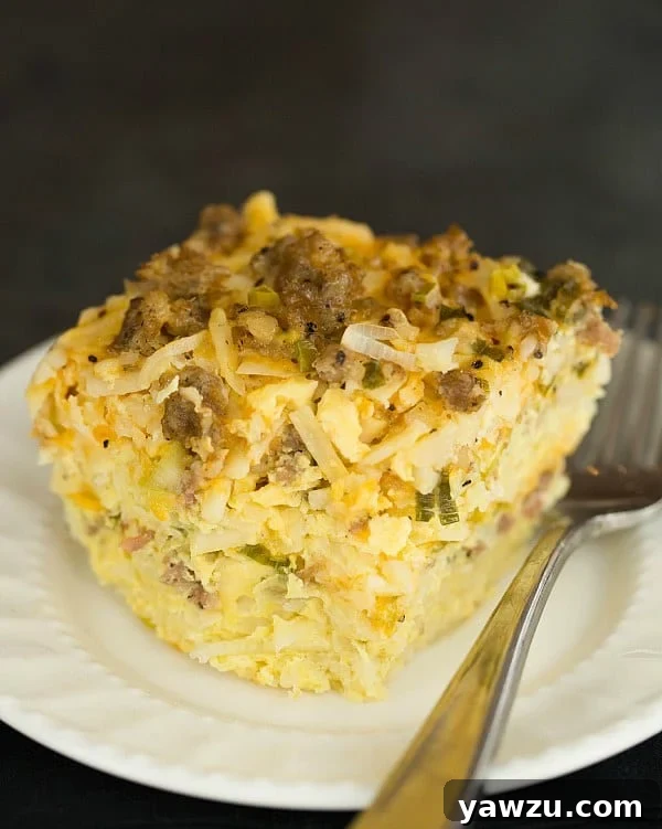 Hearty Slow Cooker Sausage, Hash Brown & Cheddar Breakfast Casserole - perfect for a stress-free holiday morning.