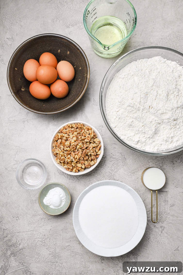 A collection of fresh ingredients for baking biscotti, neatly prepped in bowls, including flour, sugar, eggs, oil, milk, and butternut flavoring.