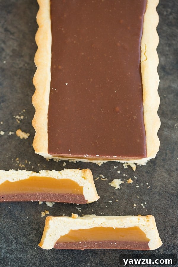 Close-up of a slice of Twix Candy Bar Tart
