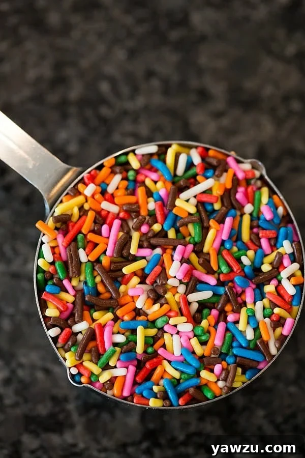 Close-up of fluffy homemade funfetti cupcake batter with colorful sprinkles