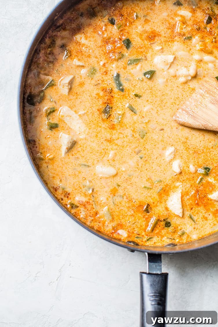 White Chicken Chili simmering on the stove.