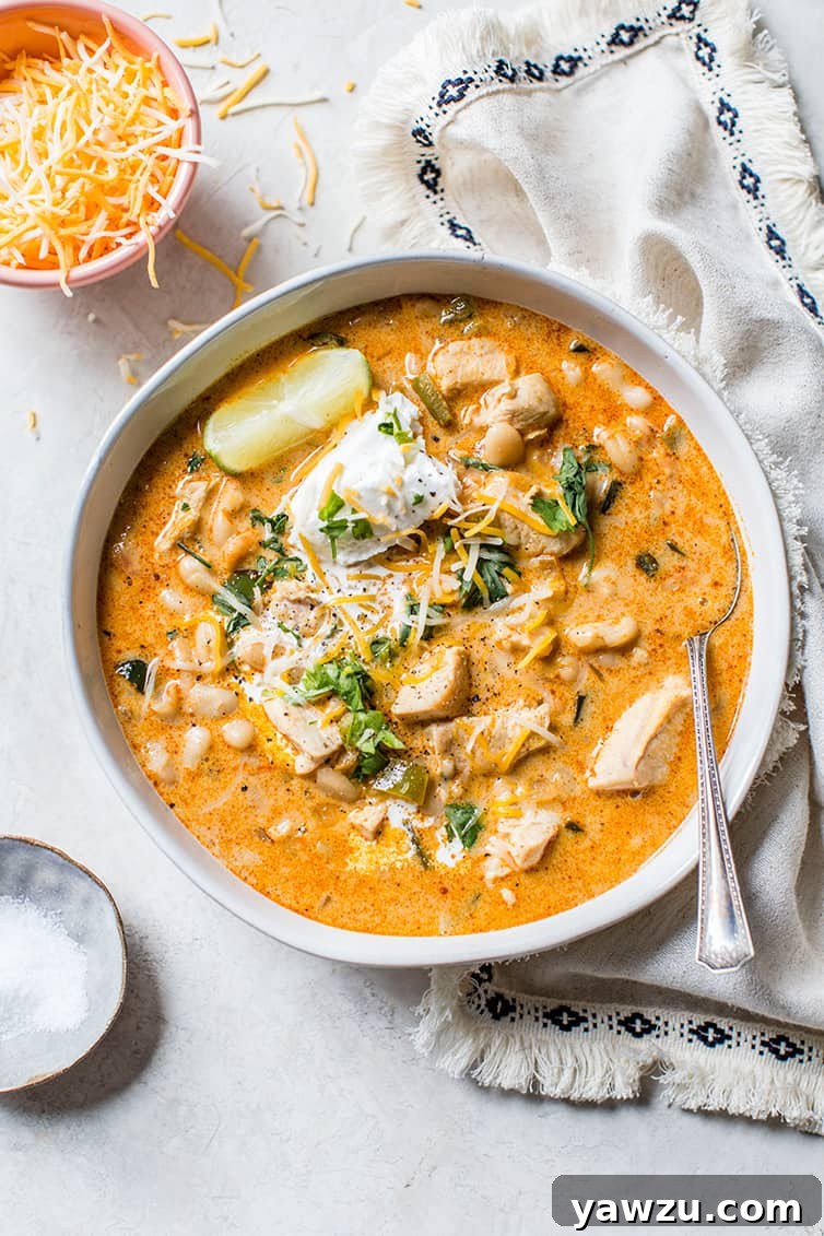 An overhead shot of a bowl of white chicken chili.