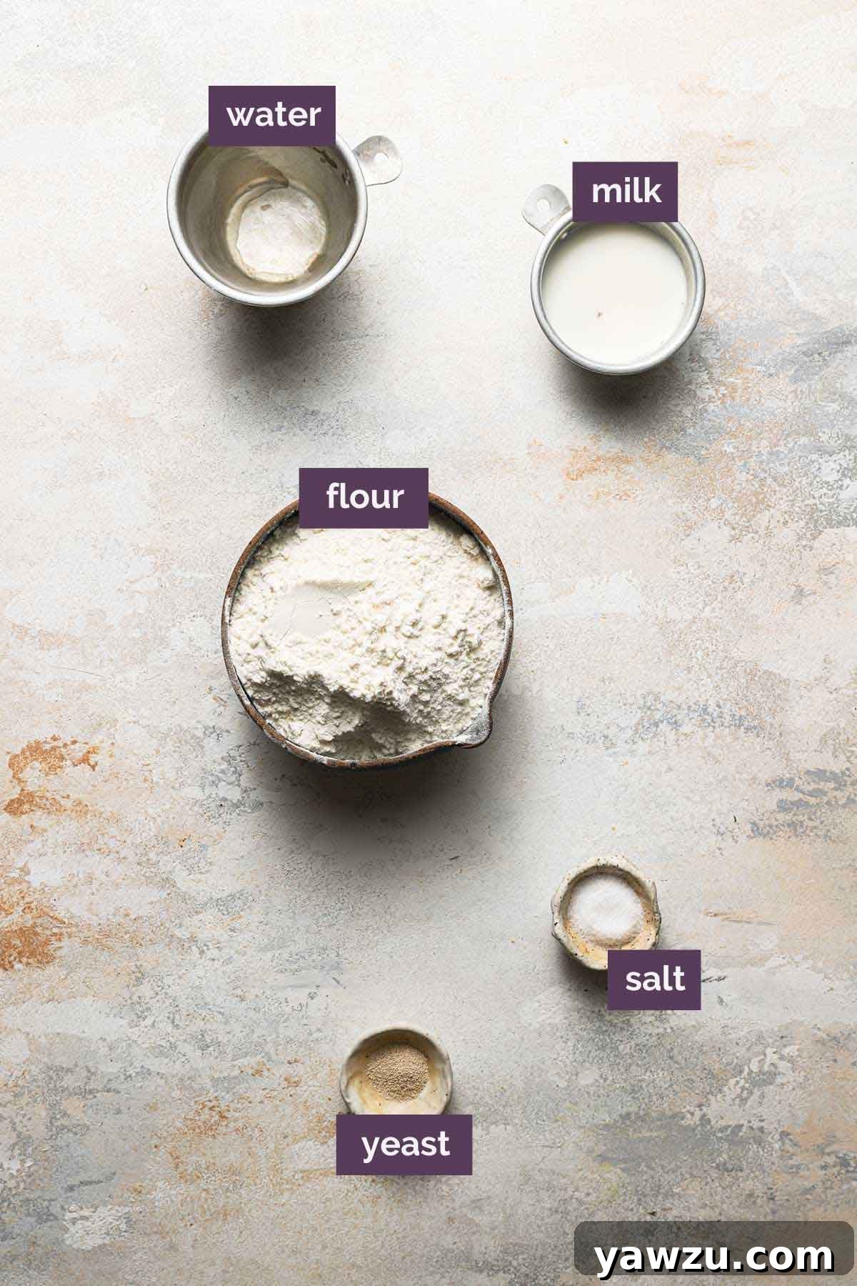 Ingredients for ciabatta bread dough prepped and labeled on a kitchen counter.