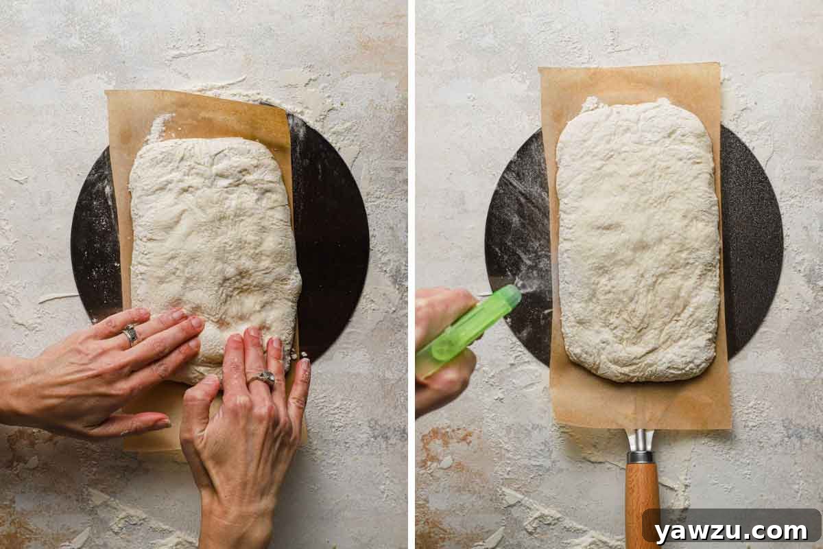 Final shaping of ciabatta dough on a pizza peel and spraying it with water before baking for a perfect crust.
