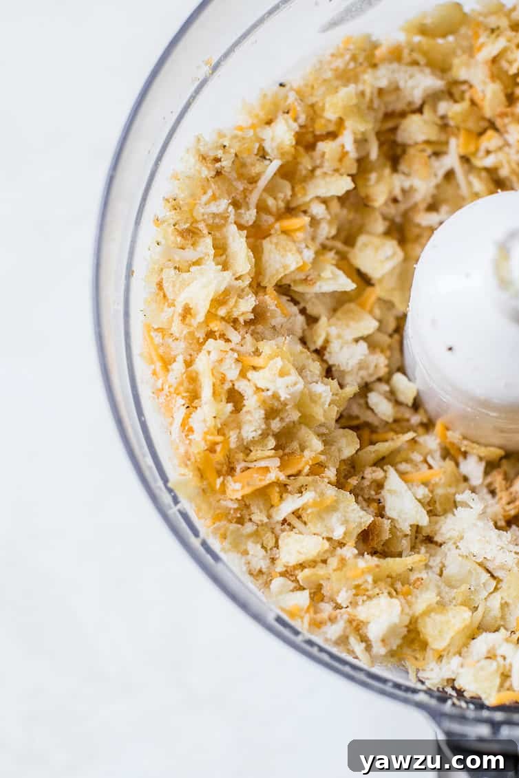 The crispy potato chip and breadcrumb topping for tuna noodle casserole, perfectly pulsed in a food processor, ready for baking.