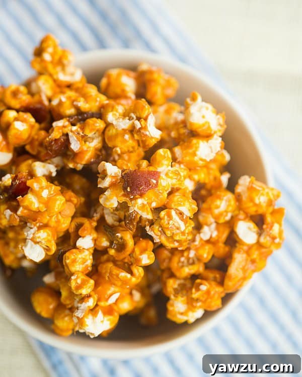 Bourbon Bacon Cashew Caramel Corn - a gourmet twist on a classic snack featuring crispy bacon, roasted cashews, and a rich bourbon caramel coating.