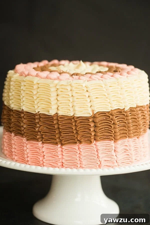 Decadent Neapolitan Cake: A Layered Masterpiece of Strawberry, Chocolate, and Vanilla