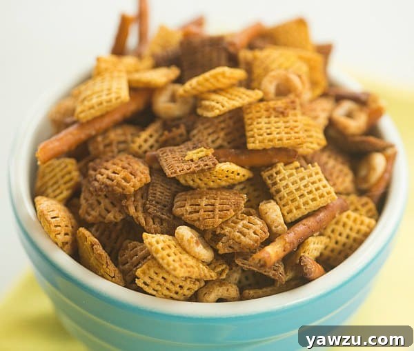 A bowl of Homemade Chex Mix showcasing its diverse ingredients.