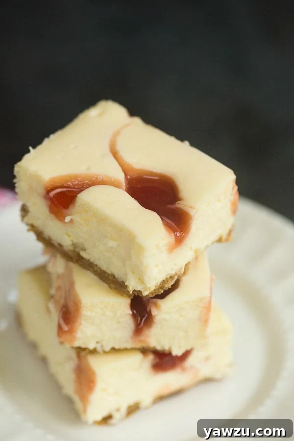 Delicious Strawberry Swirl Cheesecake Bars, a perfect blend of creamy cheesecake and fruity sweetness, ideal for summer gatherings.