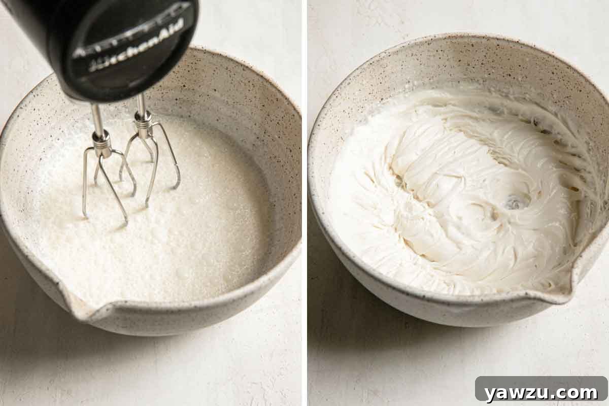 Homemade whipped cream being made in a speckled bowl with a handheld electric mixer.