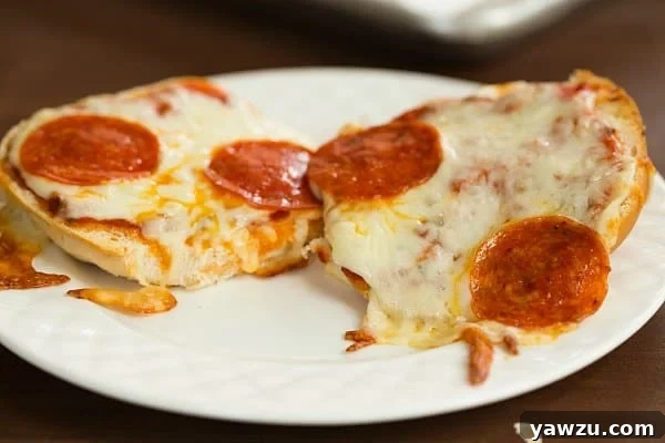 Delicious Pizza Burgers made with spaghetti sauce, mozzarella, and pepperoni, ready for a quick meal.