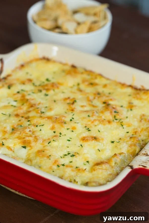 Creamy Hot Artichoke-Fontina Dip served in a baking dish