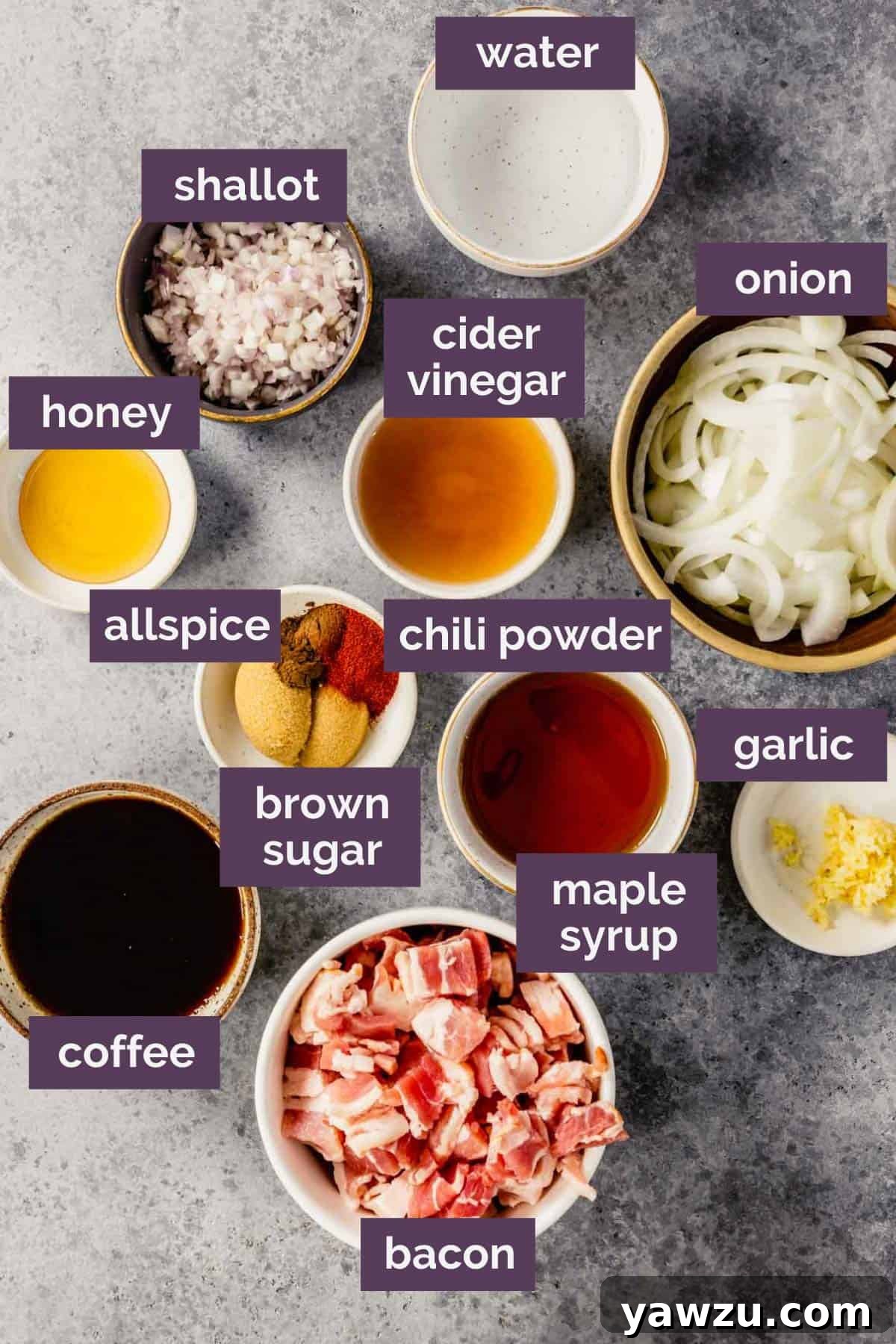 A vibrant display of fresh ingredients laid out for making bacon jam, including bacon, onions, garlic, maple syrup, and spices.