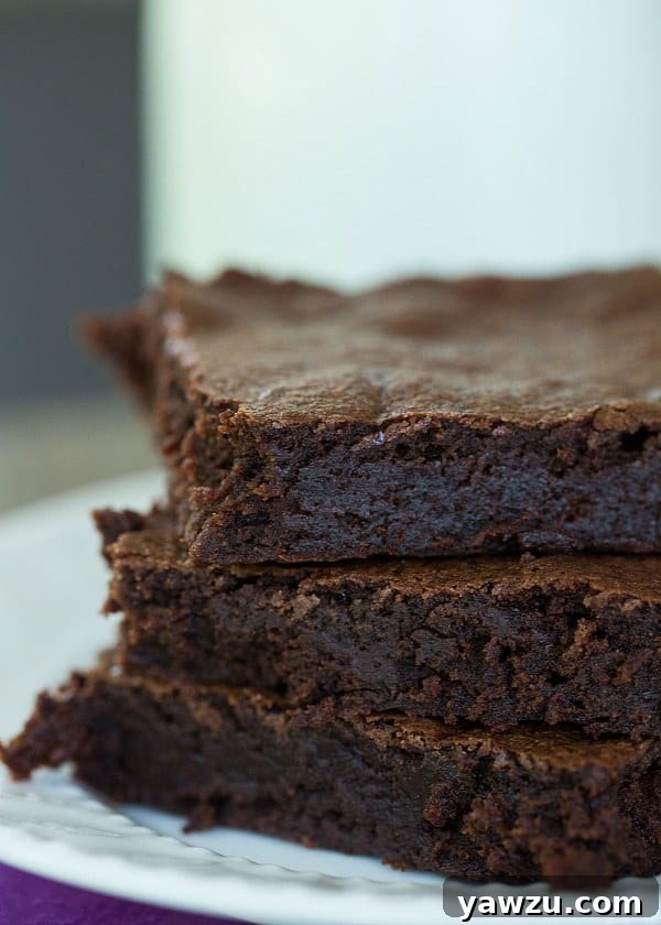 Zingerman's Black Magic Brownies stacked on a cooling rack