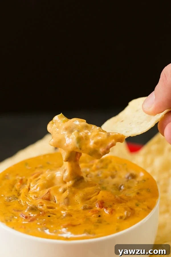 Easy Slow Cooker Queso with Ground Beef and Jalapeños