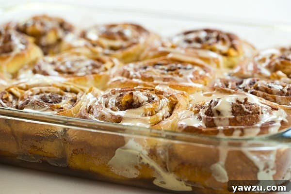 Close-up of Salted Caramel Apple Cinnamon Rolls, showing gooey caramel and apples
