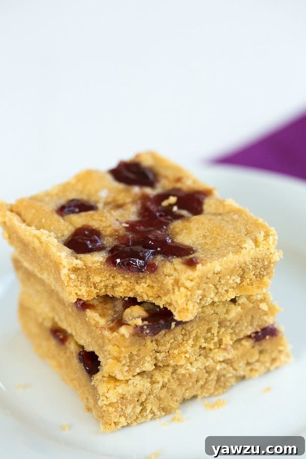 Delicious Peanut Butter and Jelly Cookie Bars, a perfect nostalgic treat